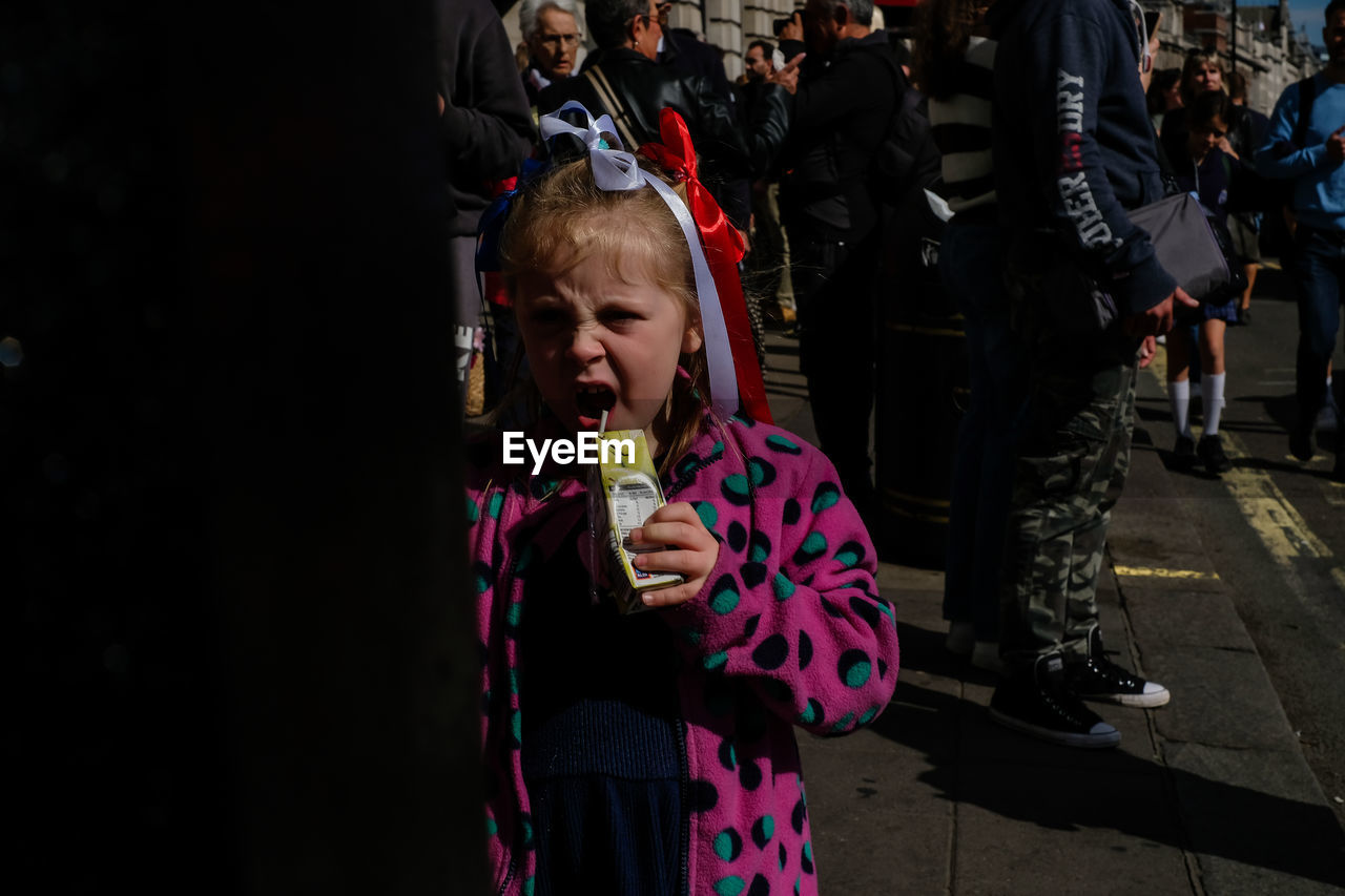 women, crowd, child, childhood, group of people, standing, clothing, female, arts culture and entertainment, lifestyles, adult, person, performance art, holding, leisure activity, event