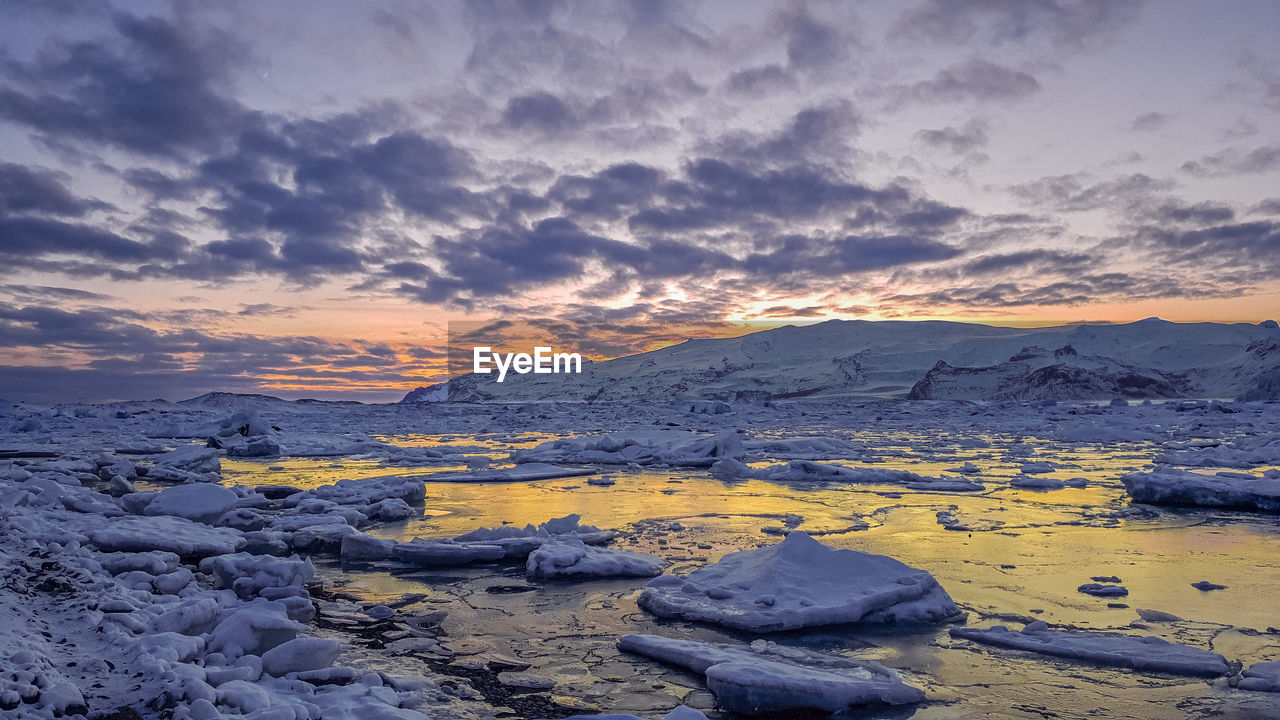 Scenic view of jökulsarión glacier at sunset