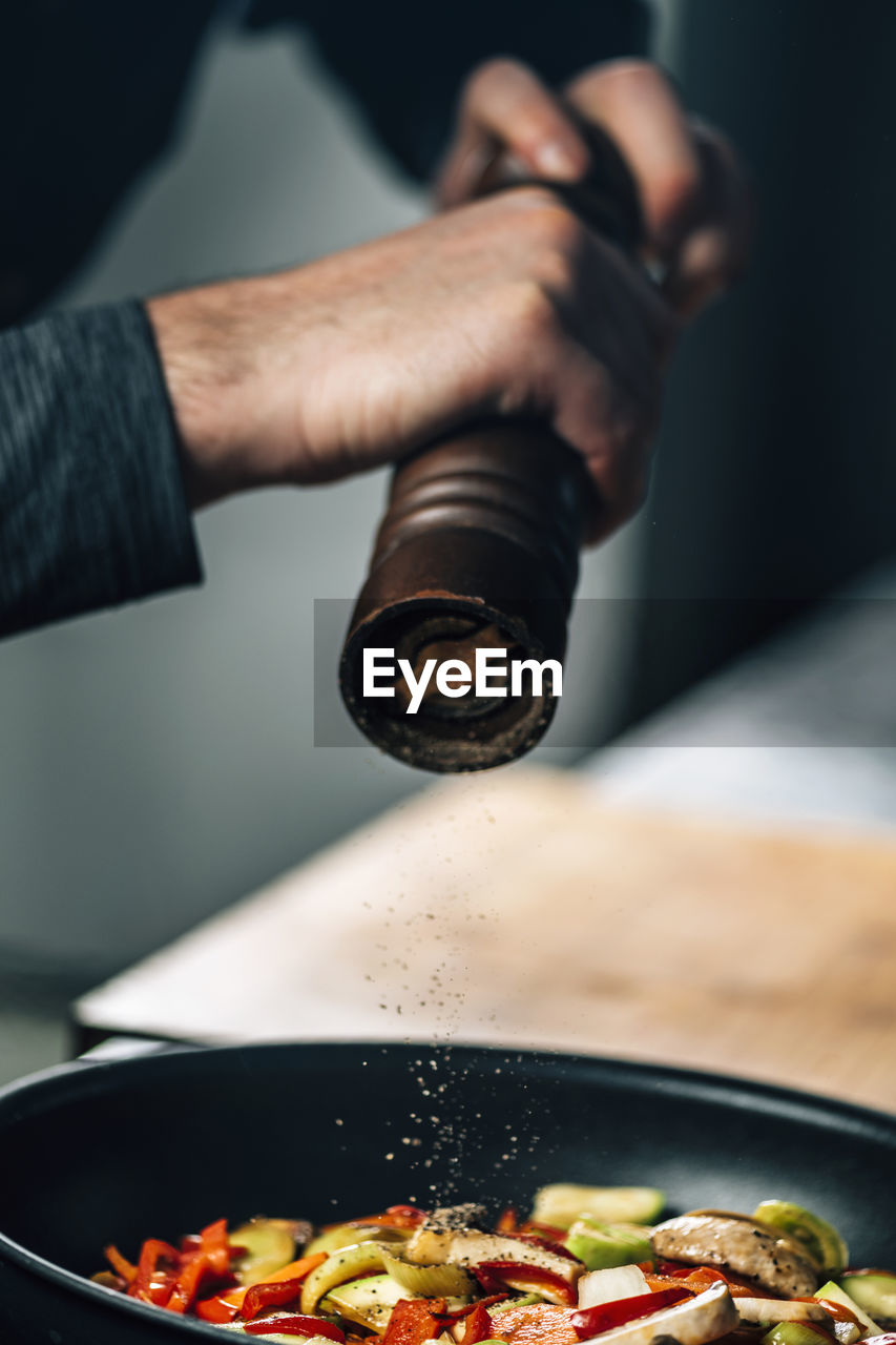 Close-up of chef preparing food in kitchen