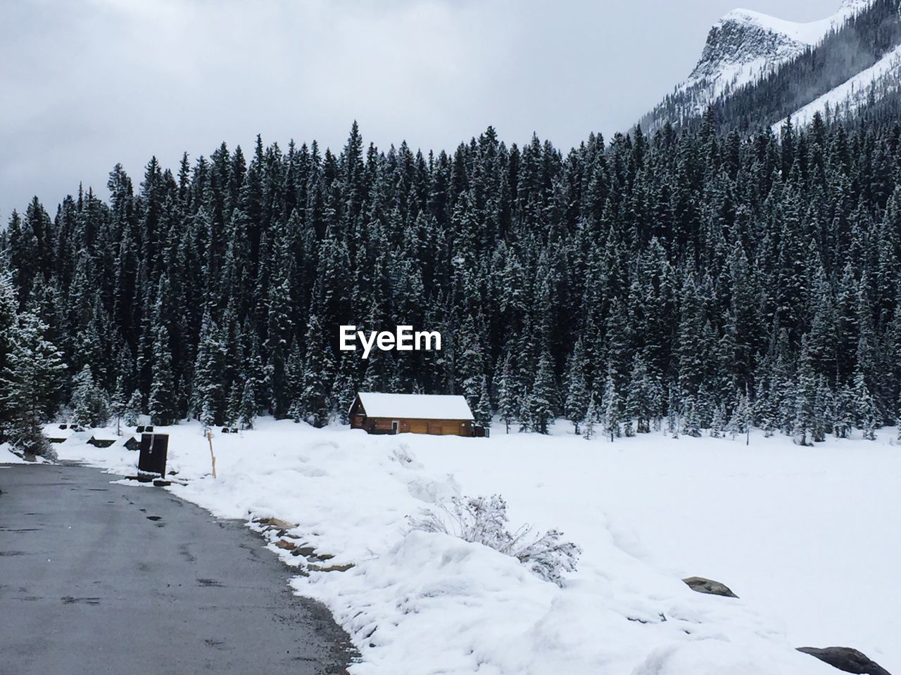 Scenic view of snow covered mountains against sky