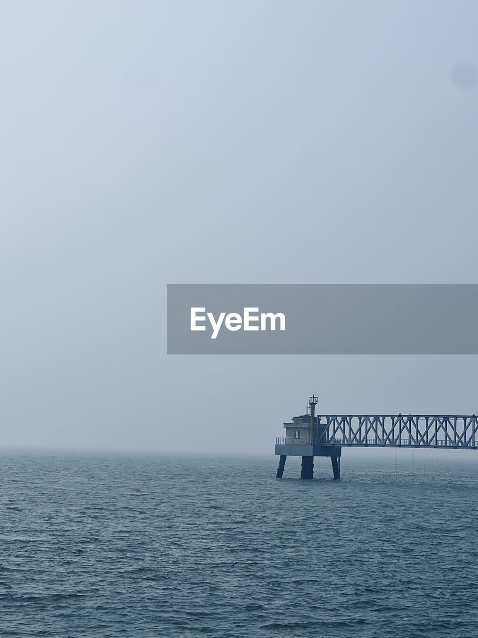 water, horizon, sea, ocean, sky, horizon over water, copy space, nature, scenics - nature, beauty in nature, transportation, tranquility, nautical vessel, coast, vehicle, fog, tranquil scene, day, no people, outdoors, travel, waterfront, ship, shore, wave, seascape, ferry, mode of transportation, idyllic