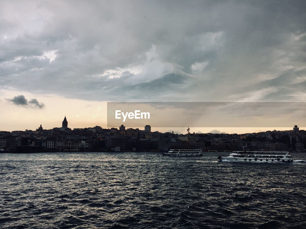 View of buildings against cloudy sky