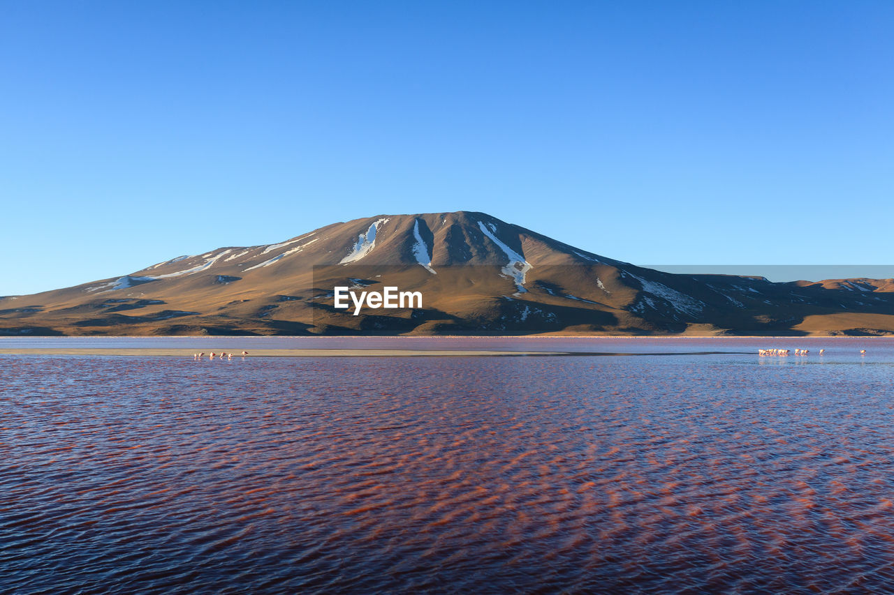 SCENIC VIEW OF MOUNTAIN AGAINST BLUE SKY