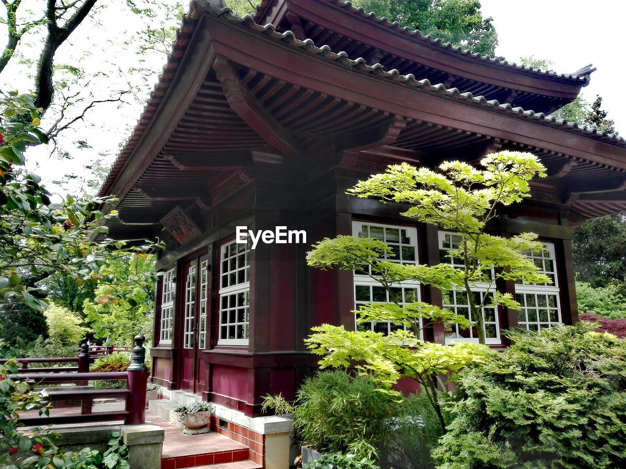 Low angle view of built structure against trees