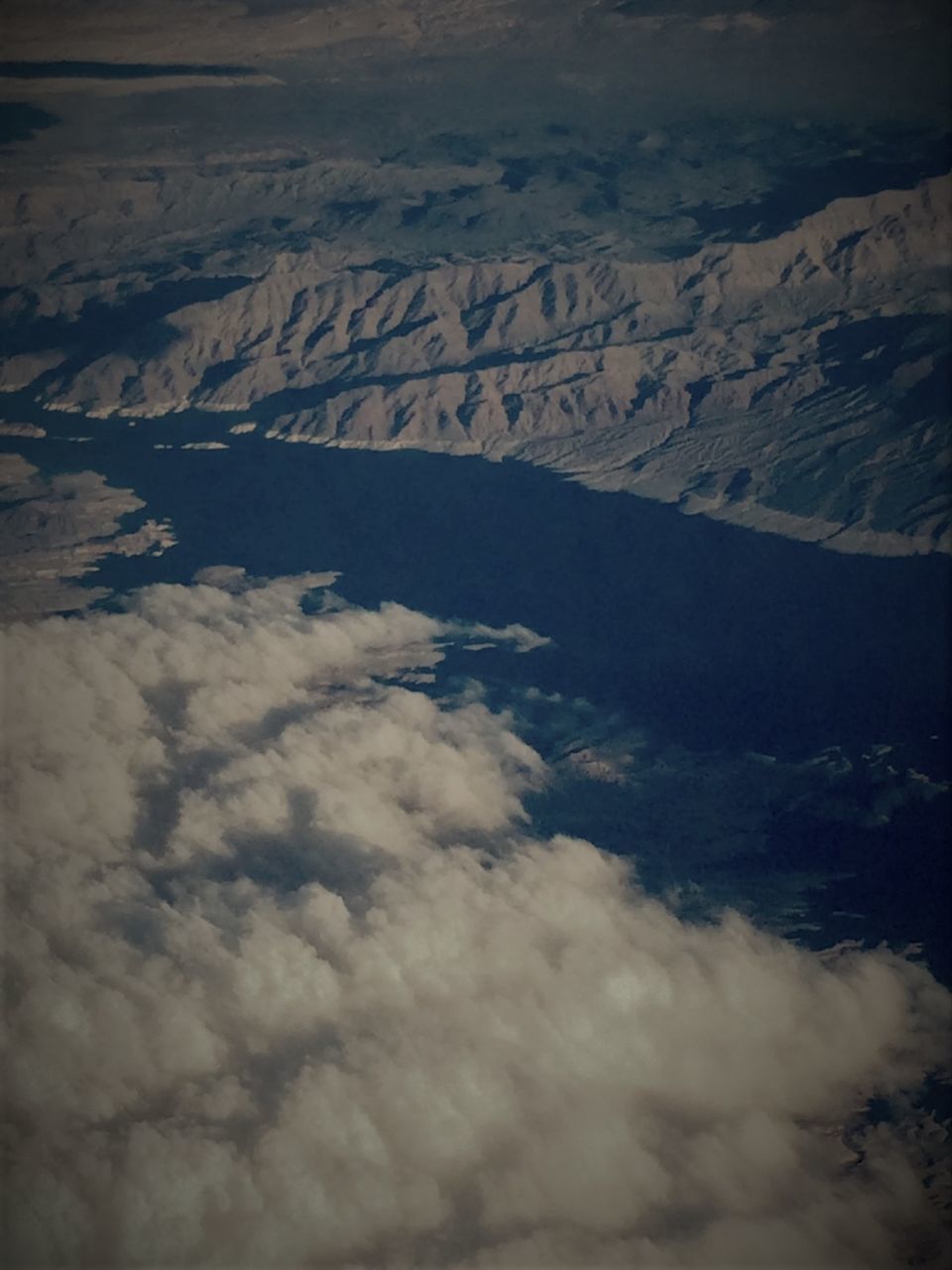 AERIAL VIEW OF CLOUDS OVER LANDSCAPE