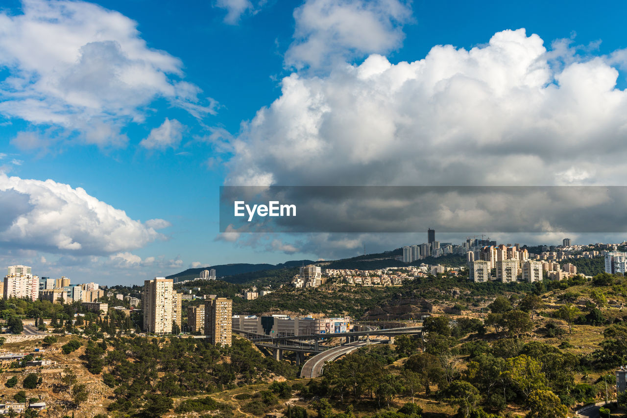 High angle view of city against cloudy sky