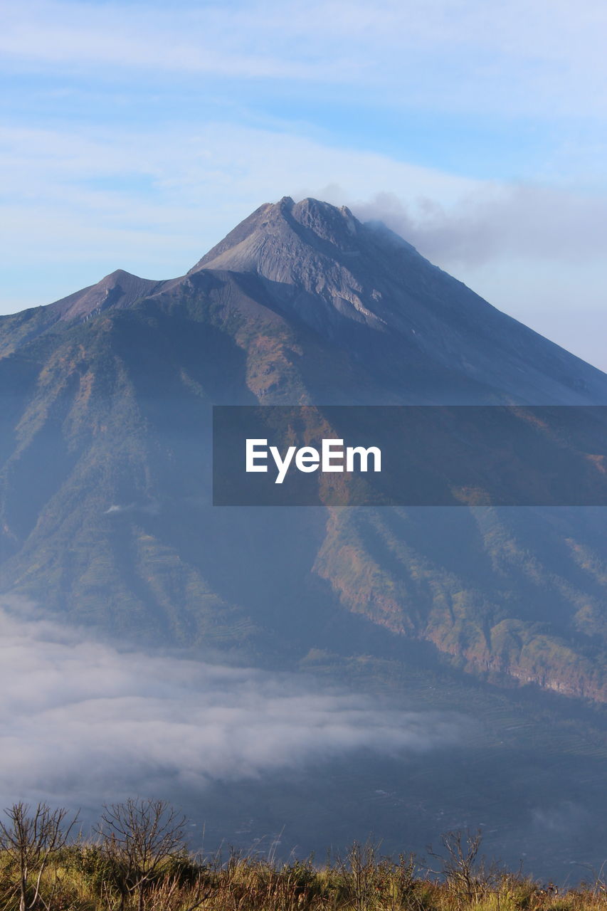 Scenic view of volcanic mountain against sky