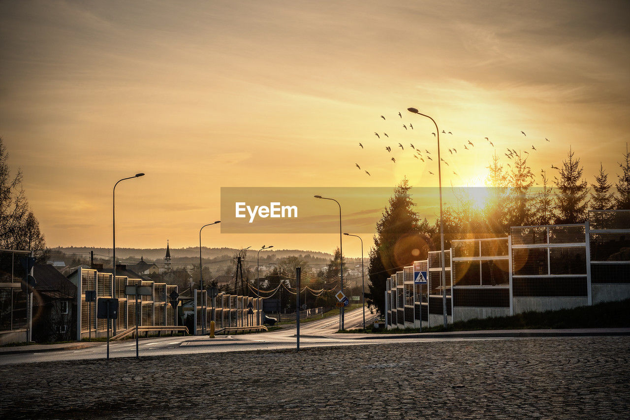 view of street against sky during sunset