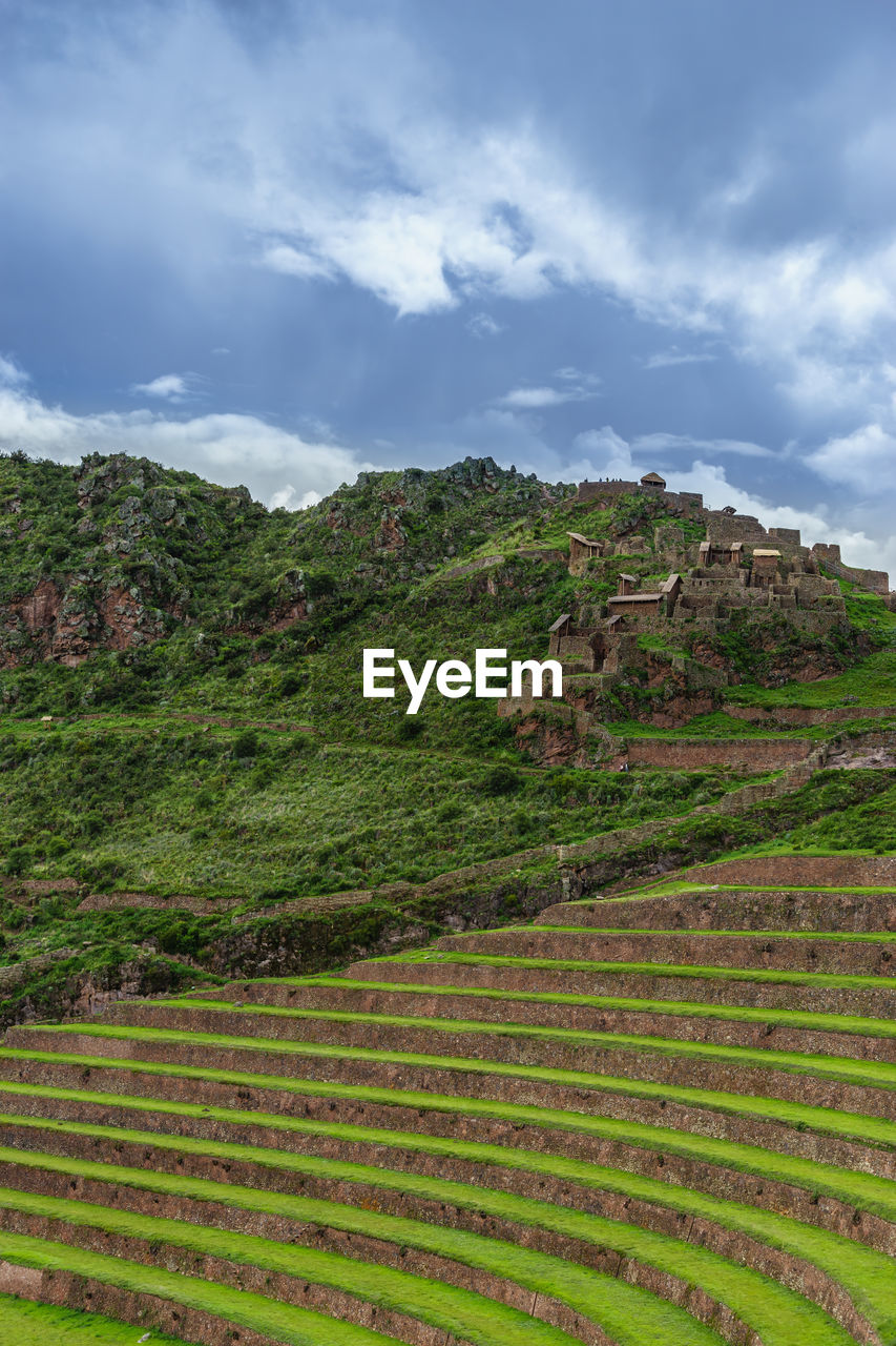 Scenic view of mountain against cloudy sky