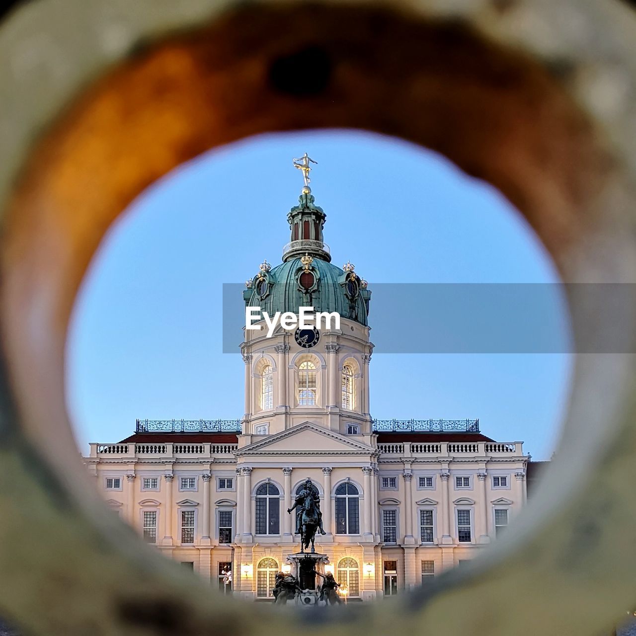Charlottenburg palace seen through hole against clear sky