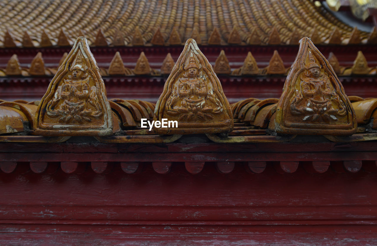 Close-up of carvings on roof