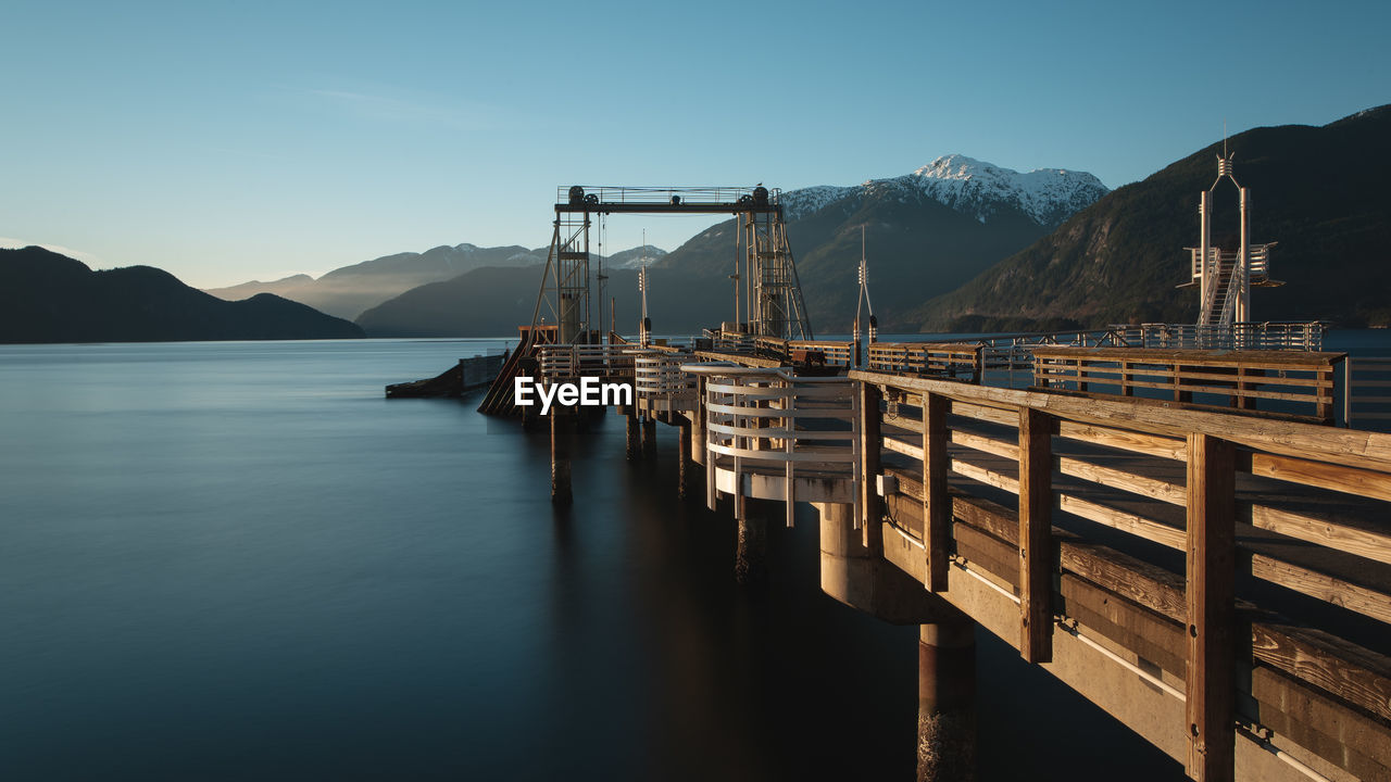 Pier over lake against sky