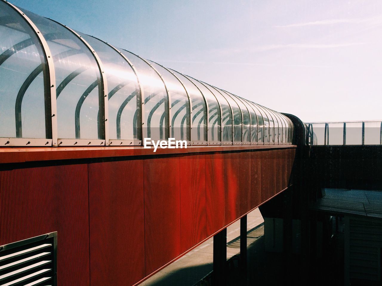 Long covered footbridge against the sky