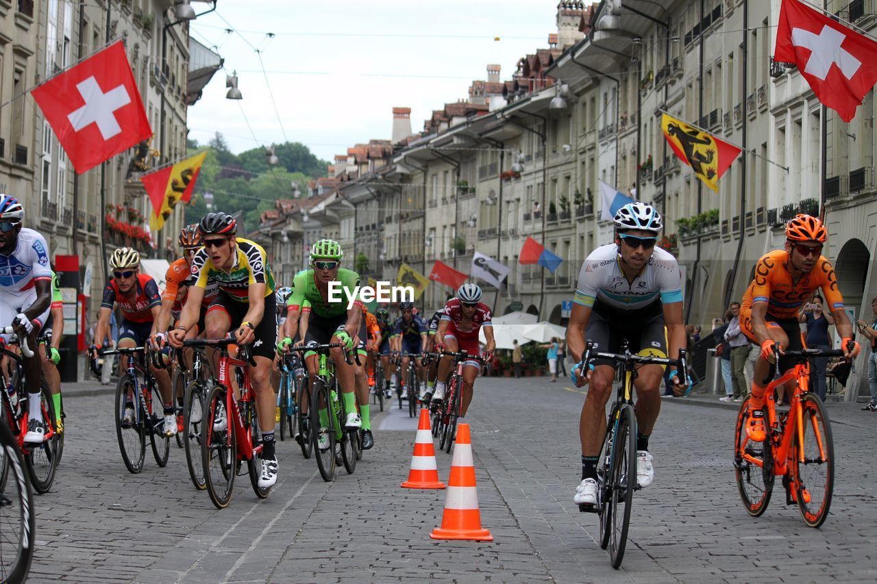 PEOPLE RIDING BICYCLES ON ROAD