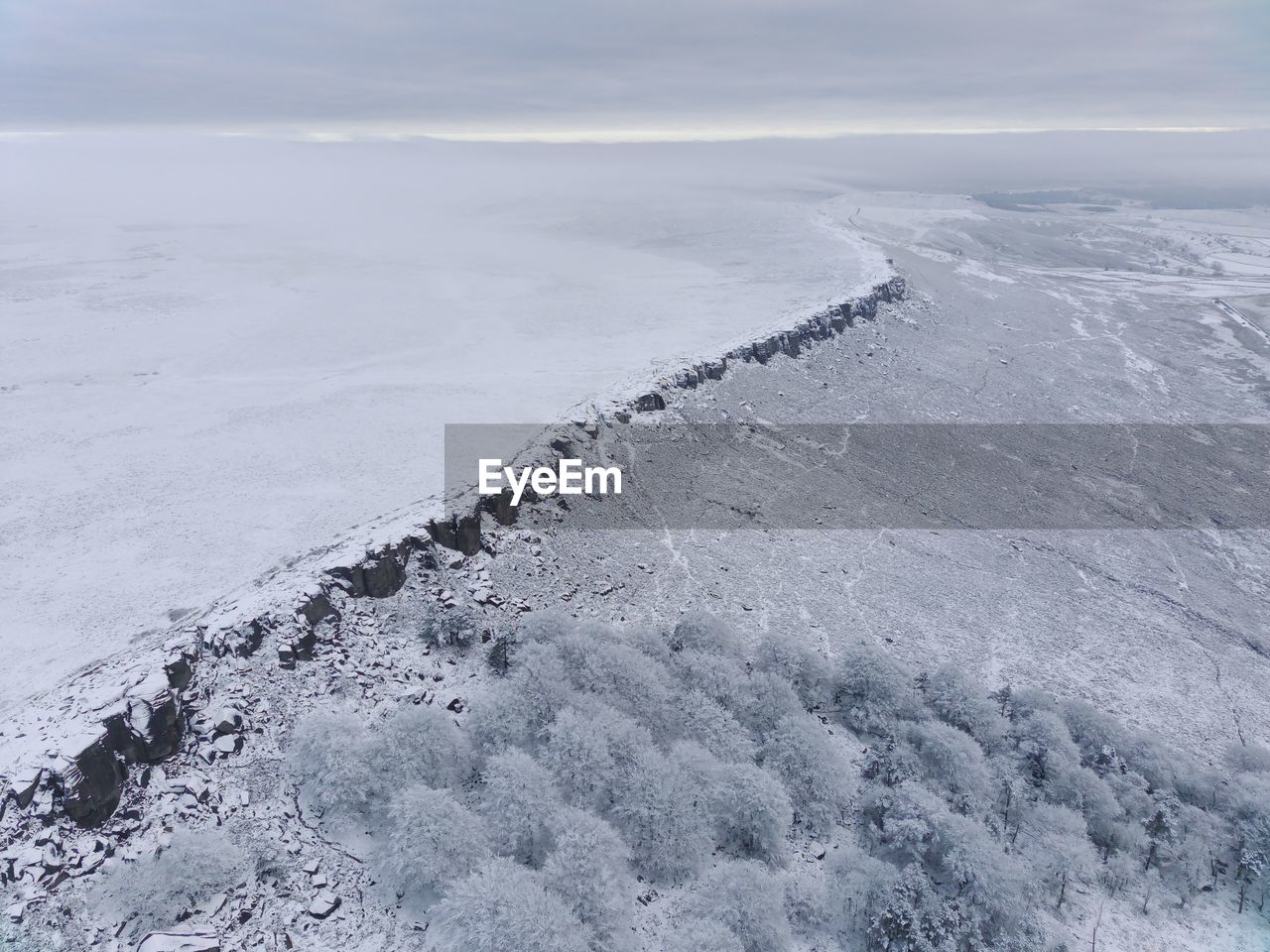 winter, snow, scenics - nature, beauty in nature, nature, cold temperature, ice, environment, landscape, land, no people, tranquility, day, water, freezing, tranquil scene, sea, tundra, sky, non-urban scene, outdoors, high angle view, cloud, frozen, mountain, beach, idyllic, remote, piste