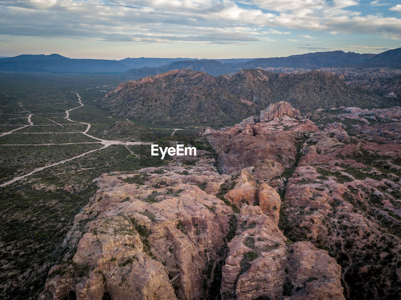 View of mountain range against cloudy sky