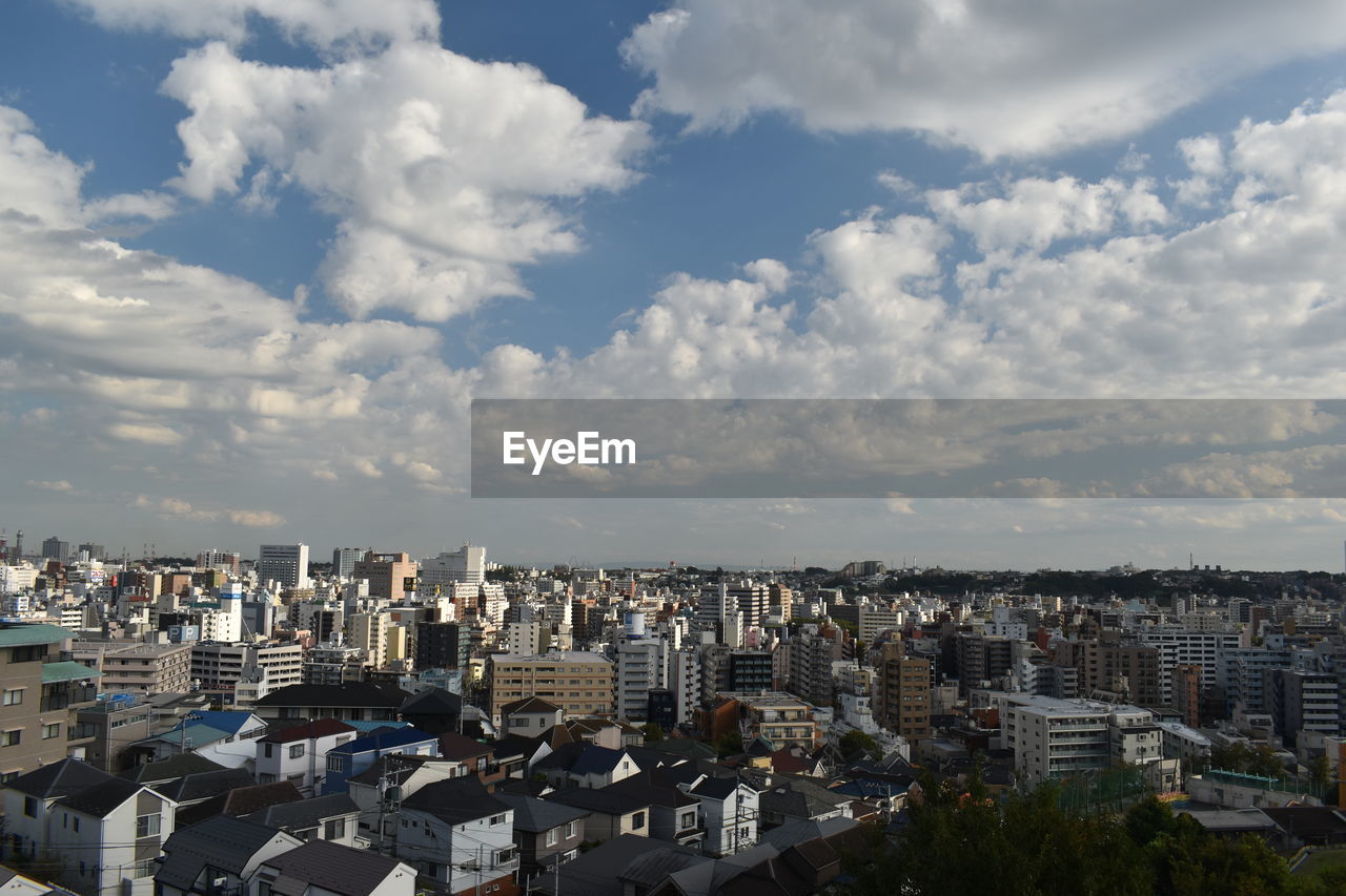 High angle view of buildings against sky in city