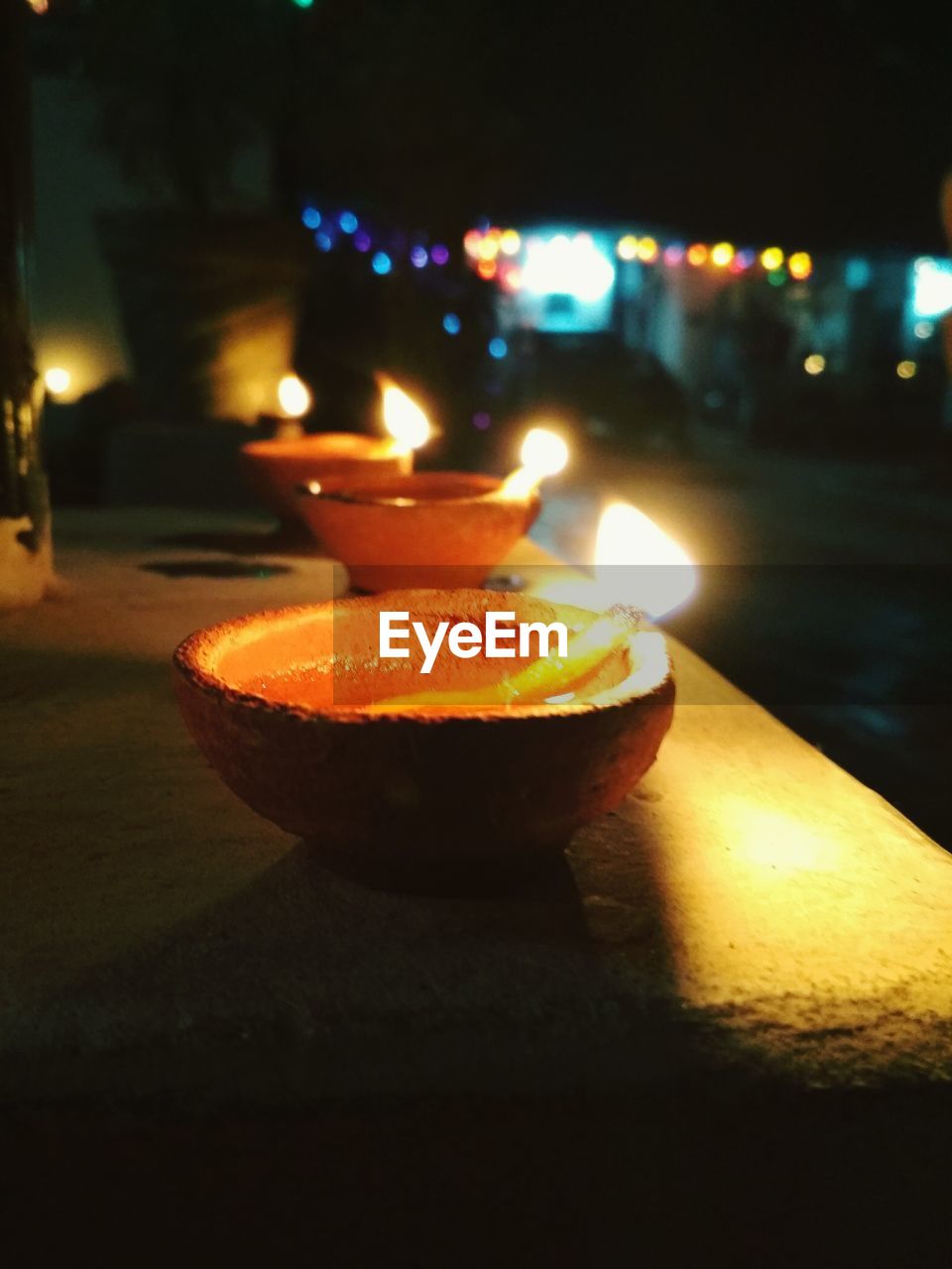 Close-up of illuminated diyas