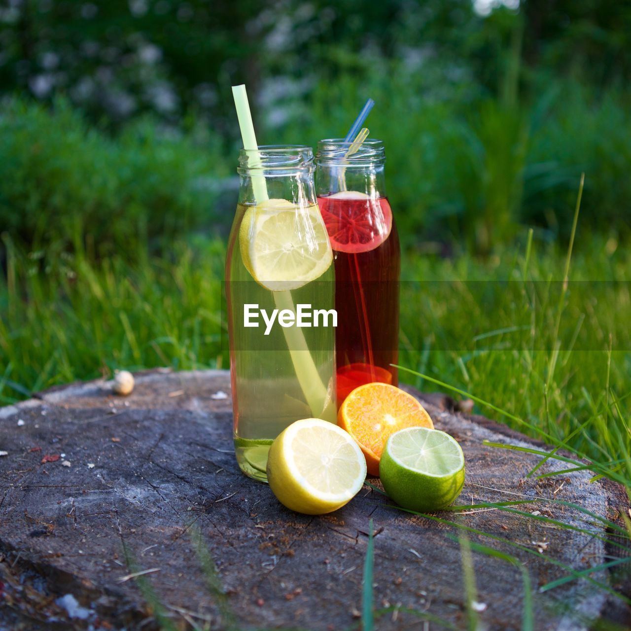 CLOSE-UP OF JUICE WITH DRINK ON TABLE AT HOME