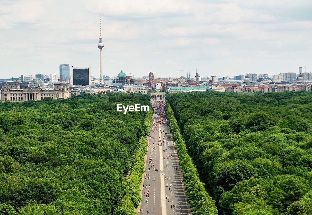 Panoramic view of city against cloudy sky