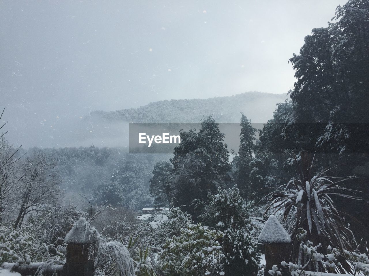 Scenic view of snow covered mountains against sky