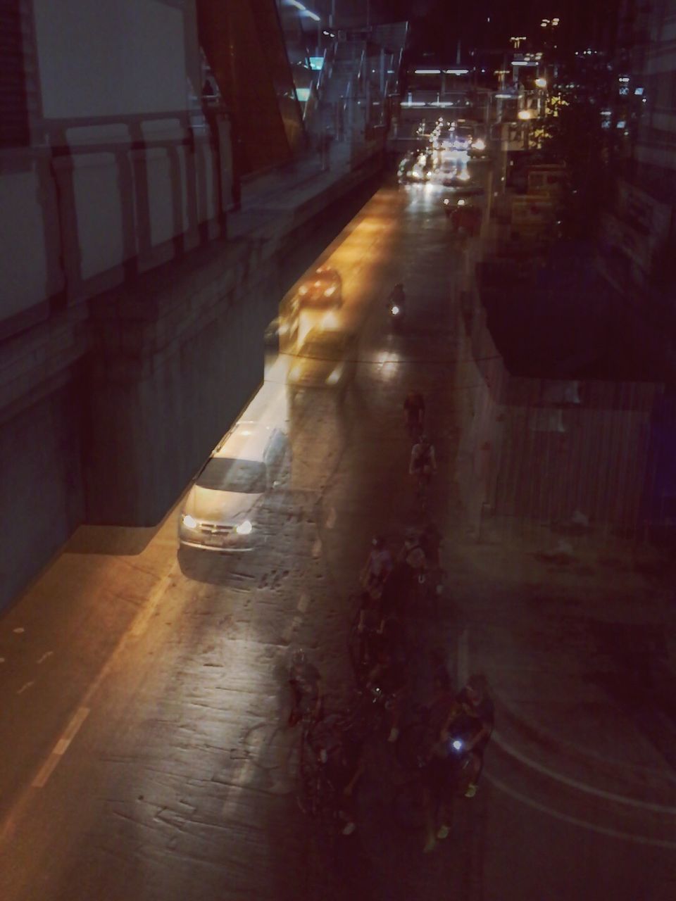 VIEW OF ILLUMINATED CITY AT NIGHT