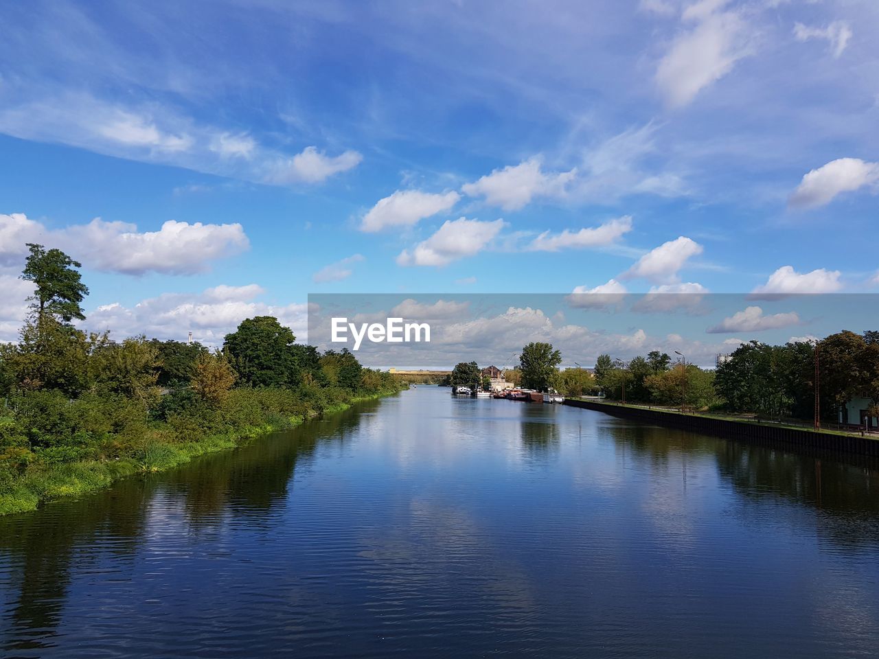 SCENIC VIEW OF LAKE BY TREES AGAINST SKY