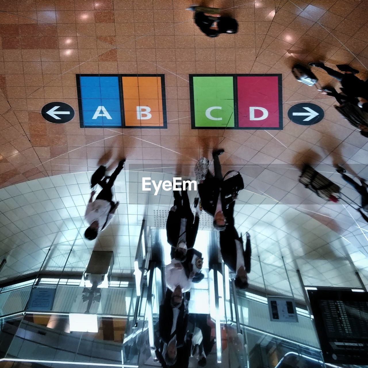 GROUP OF PEOPLE IN SHOPPING MALL