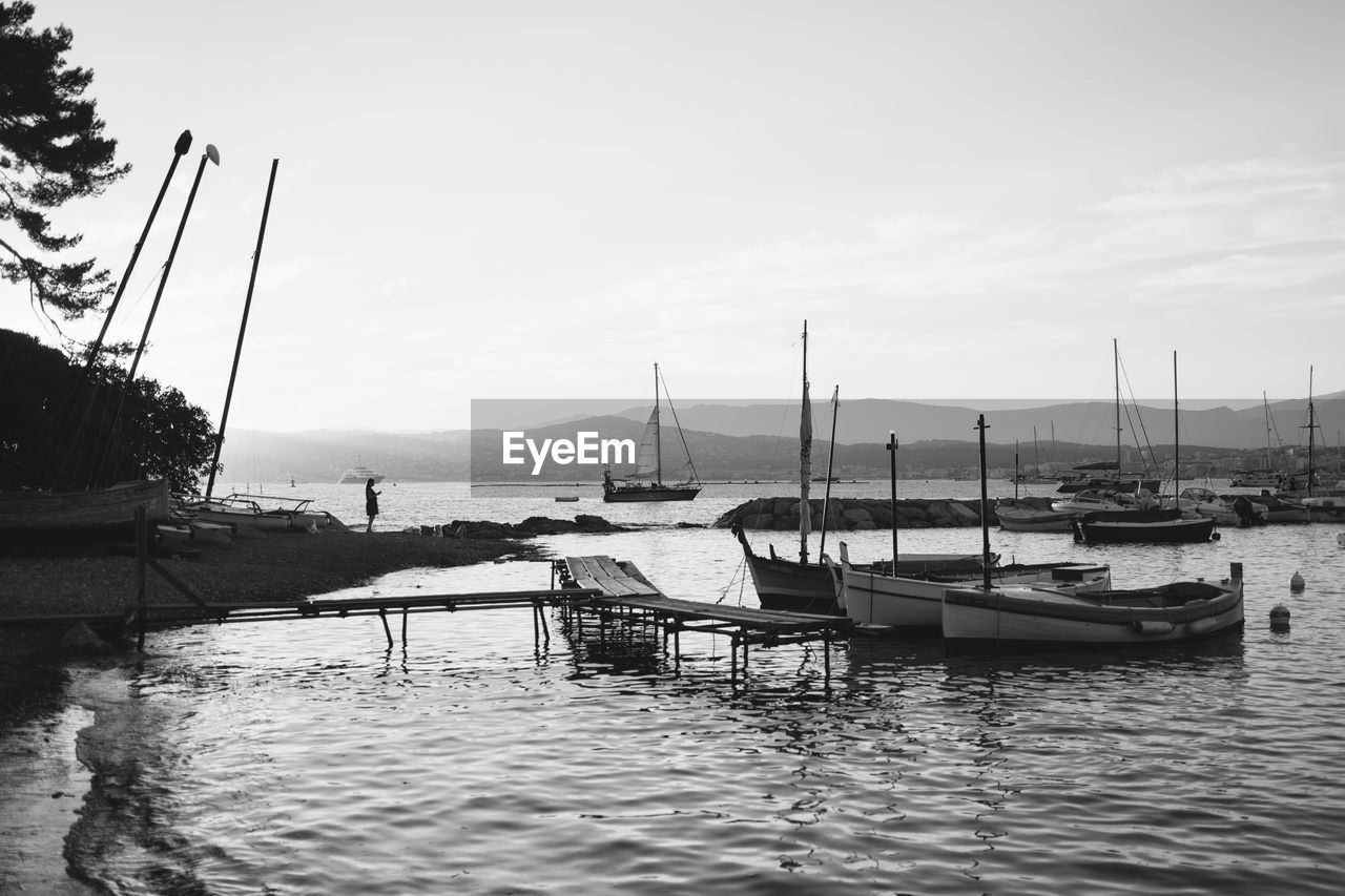 BOATS MOORED IN HARBOR