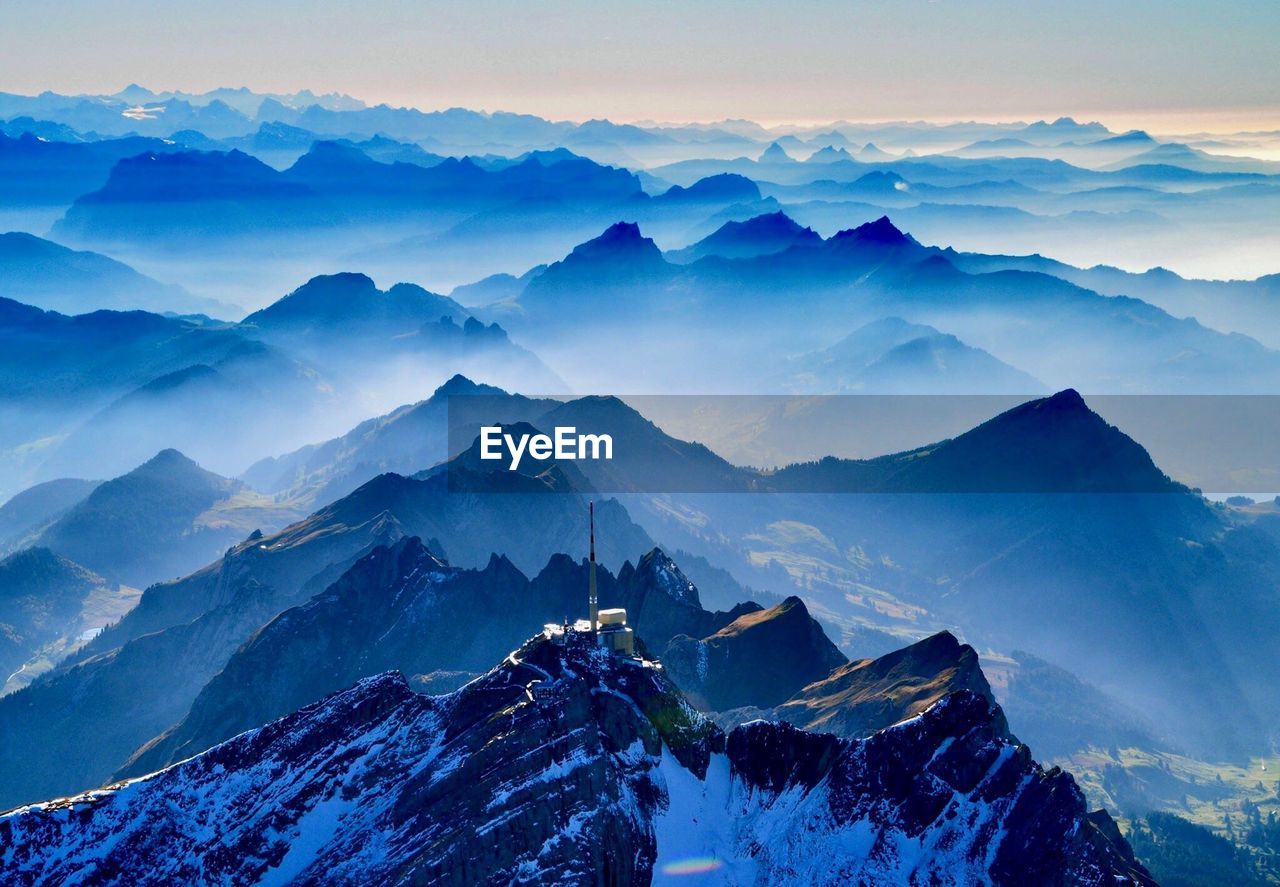 Scenic view of snowcapped mountains against sky