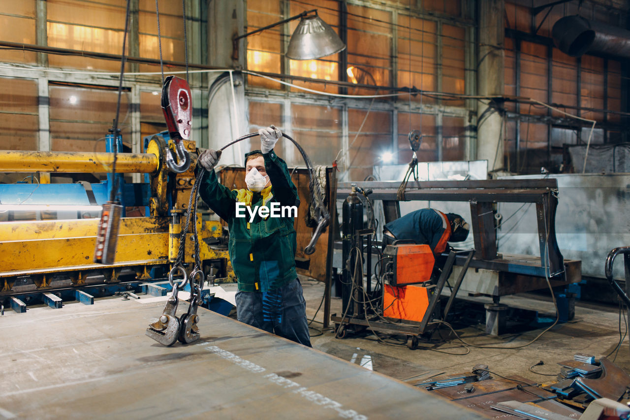 low section of man working at construction site