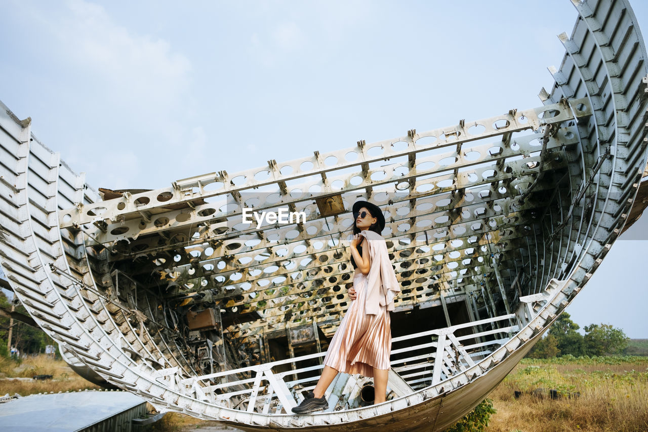 Woman standing on structure