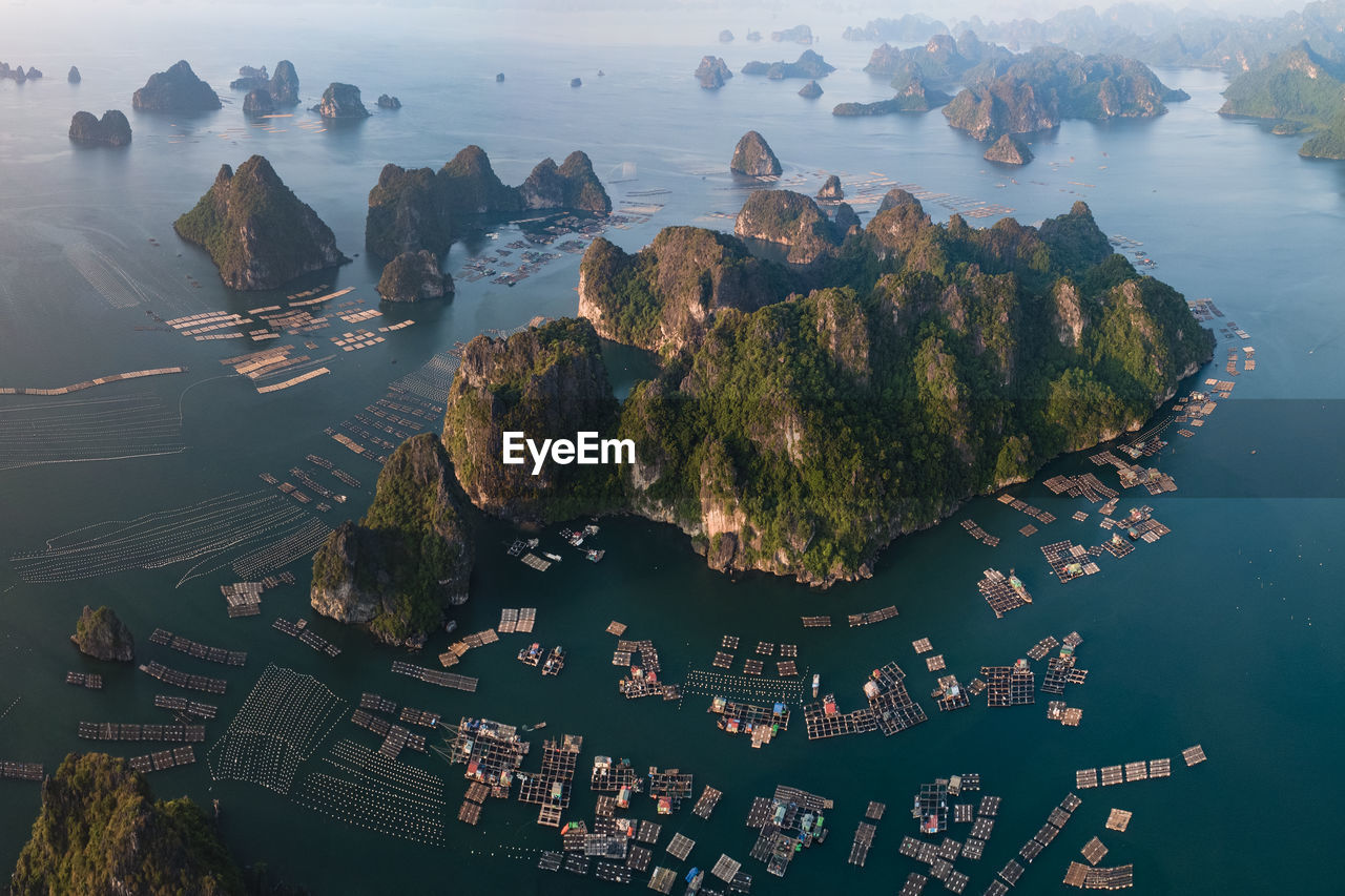 High angle view of mountains by sea