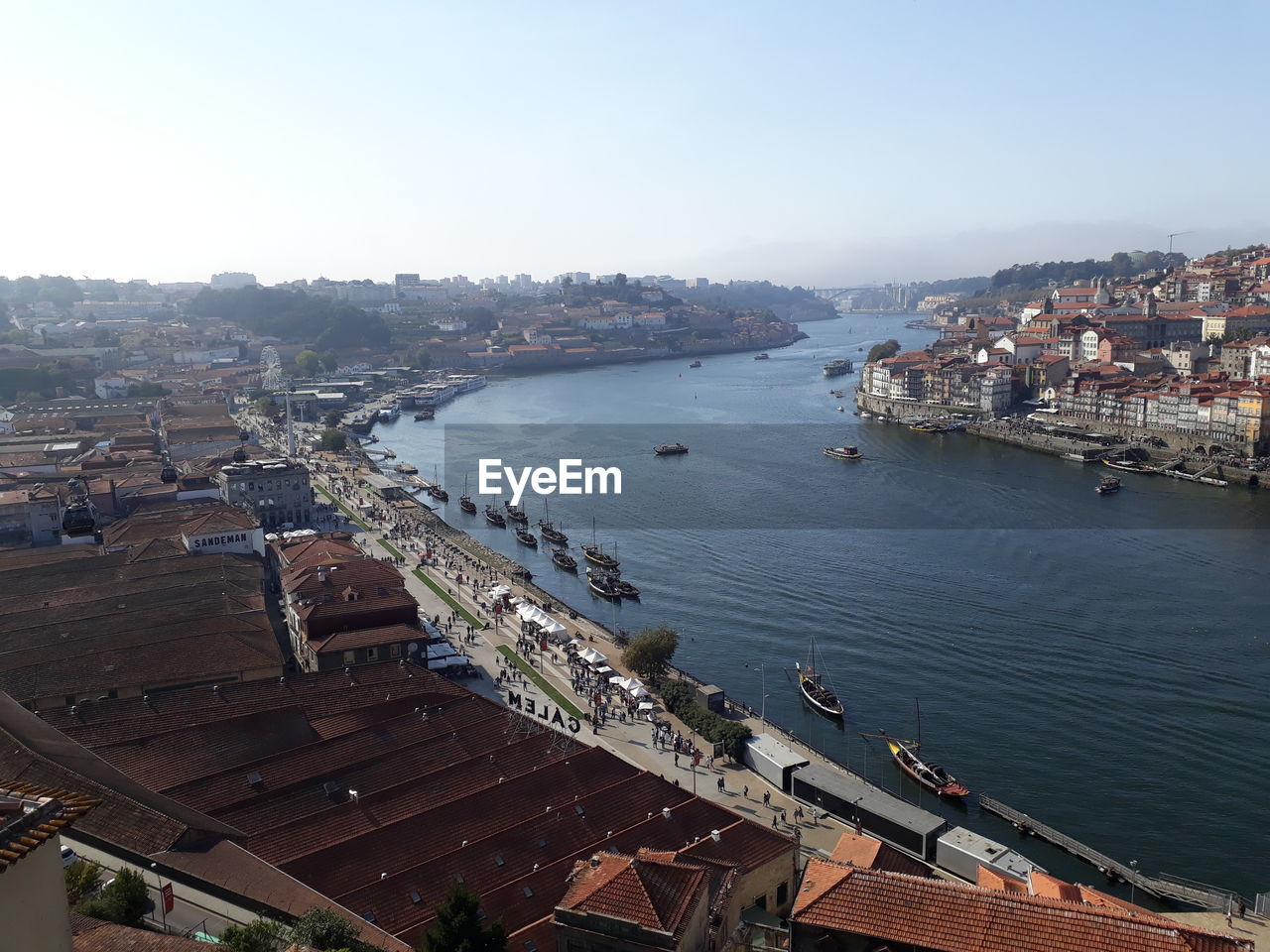 High angle view of river and buildings in city