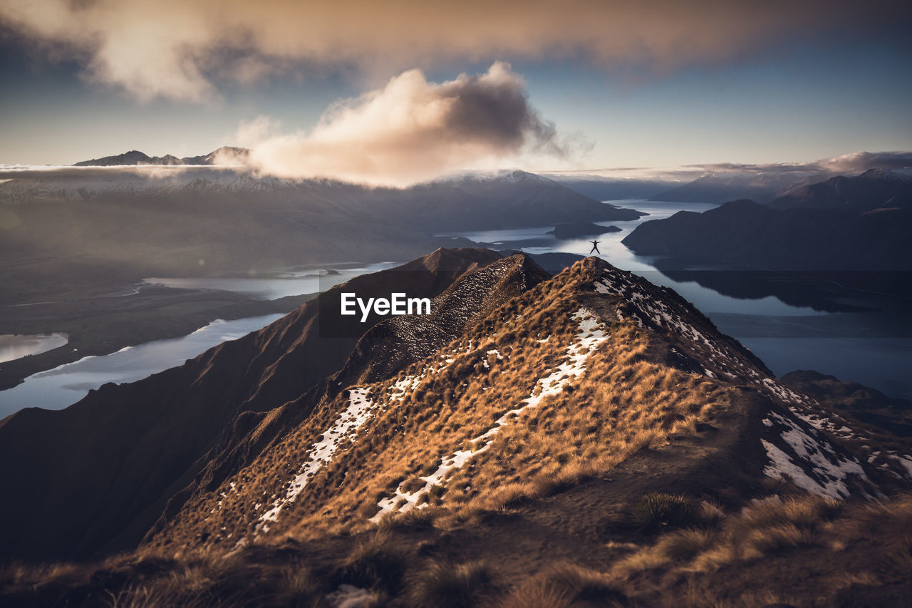 Aerial view of mountains against sky during sunset