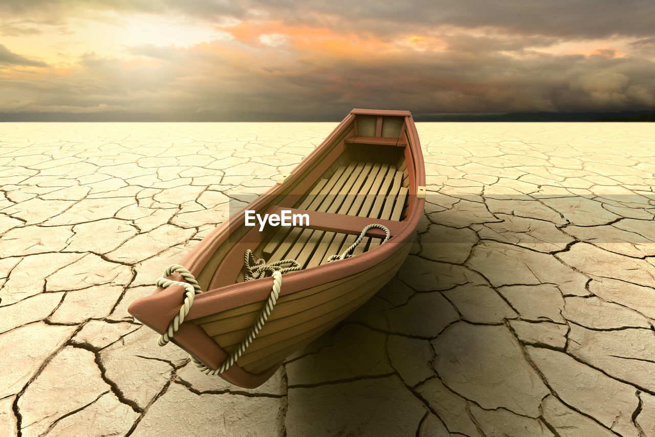 A drought with a boat on a dry lake