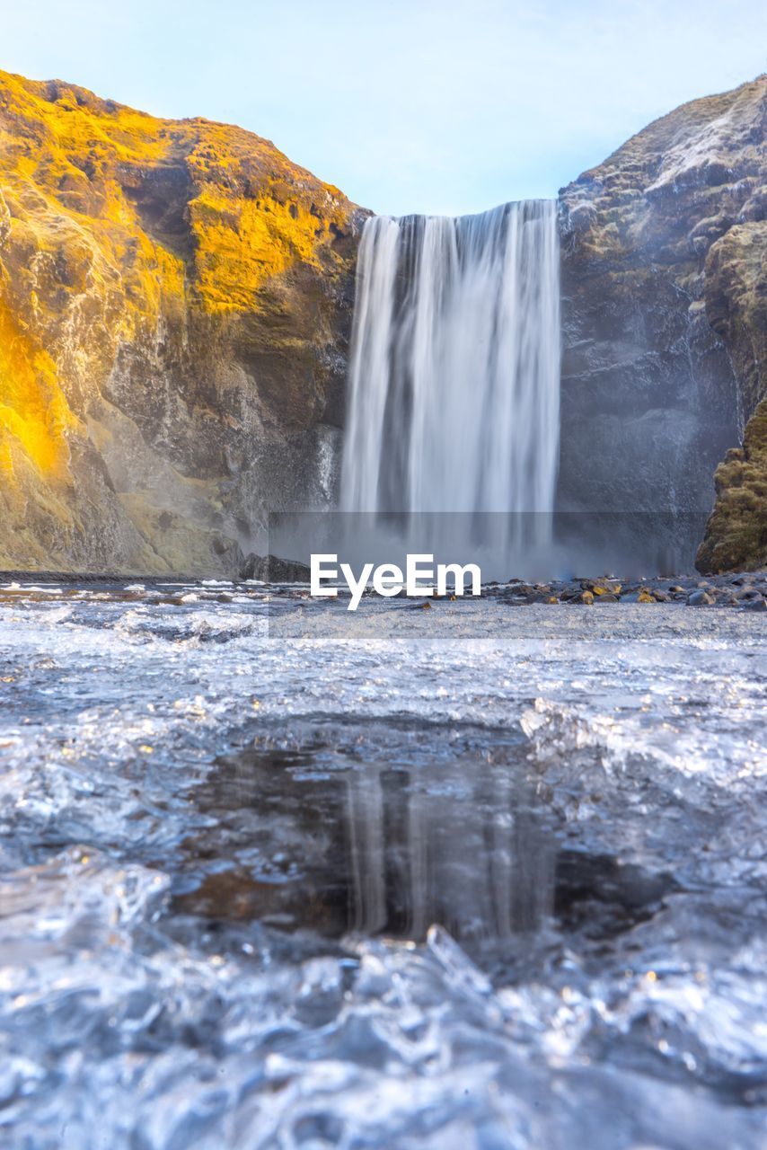 WATERFALL AGAINST SKY