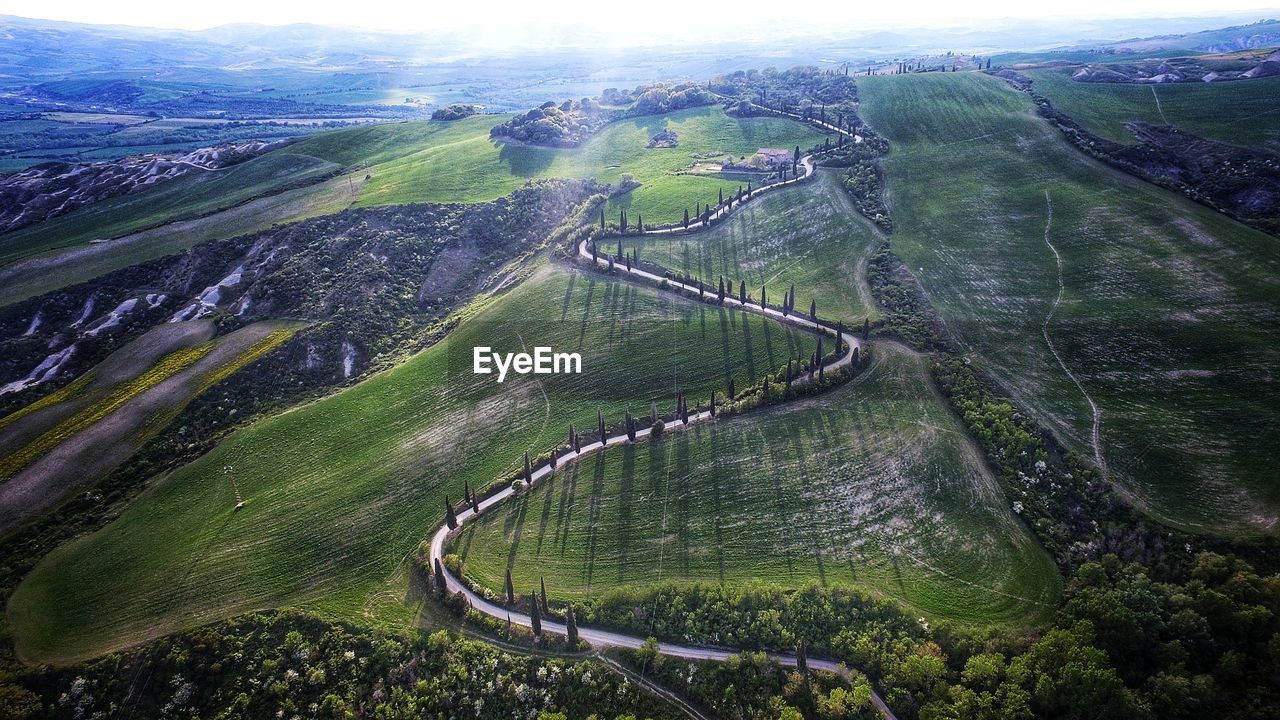 High angle view of road amidst grassy landscape