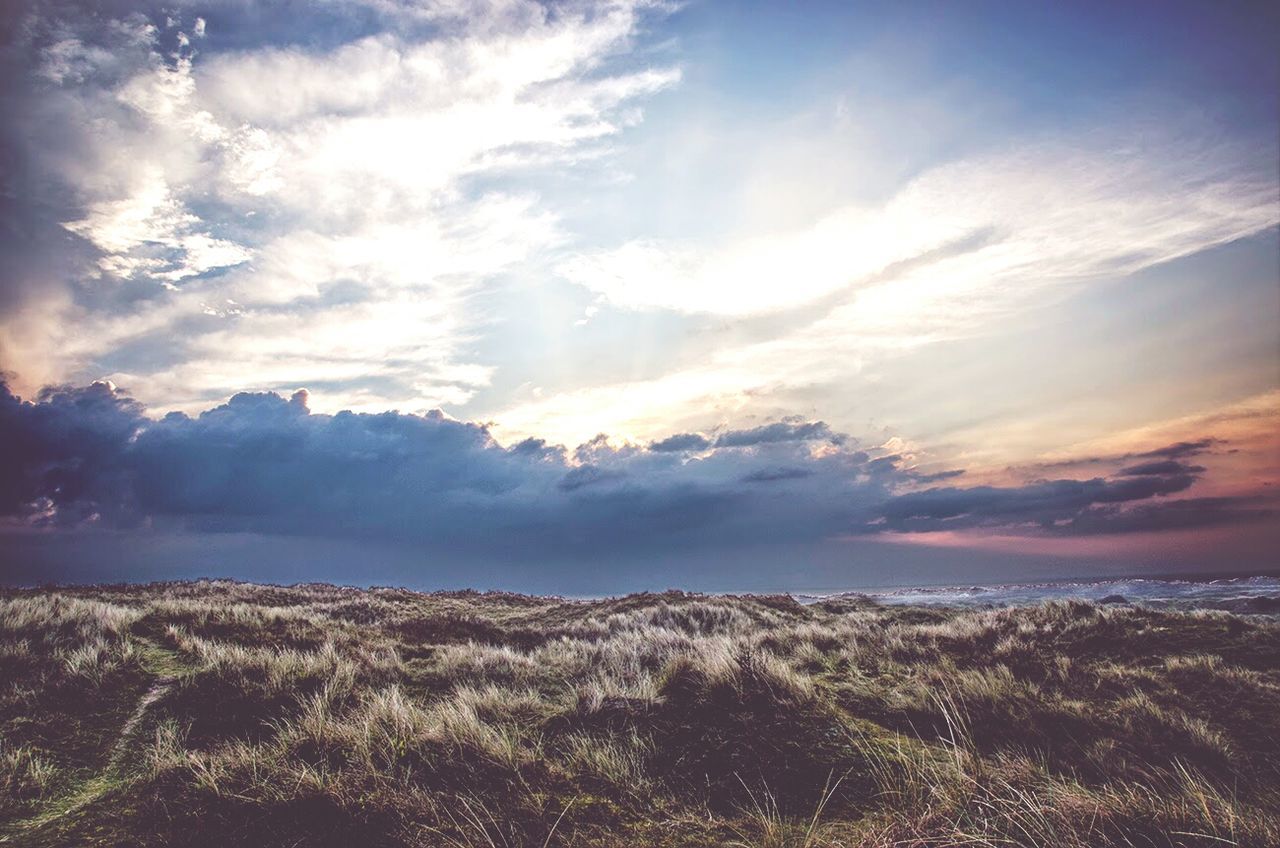 View of countryside landscape below clouds