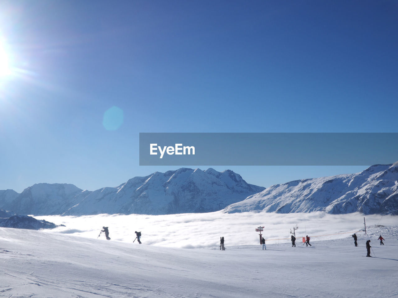 Scenic view of mountains against blue sky