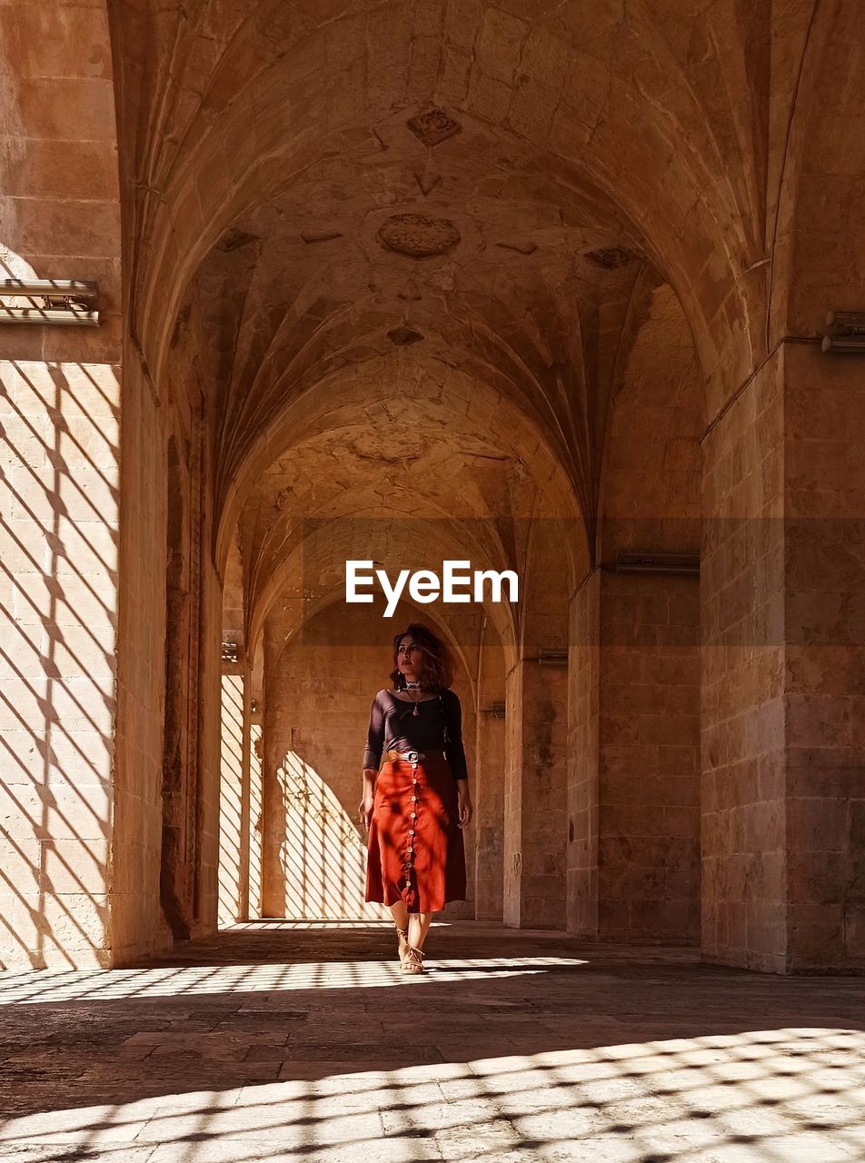 Rear view of man and woman in historic building