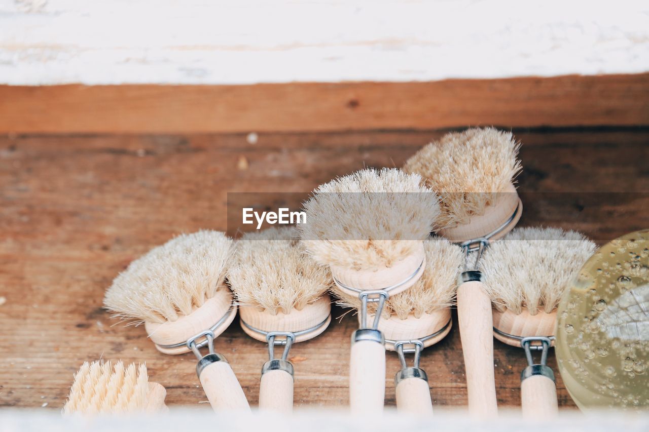 High angle view of dish brushes made of natural material on table