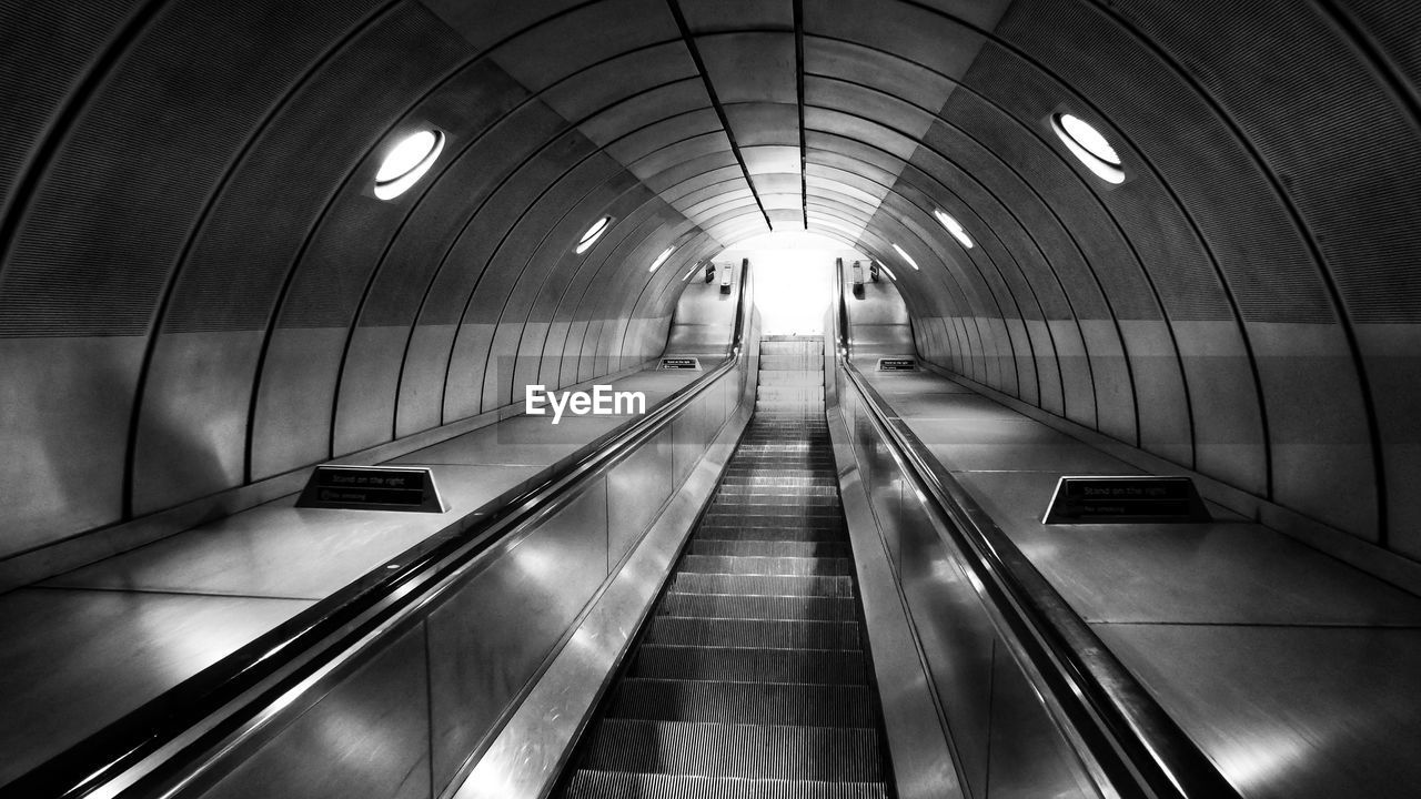 Interior of illuminated escalator