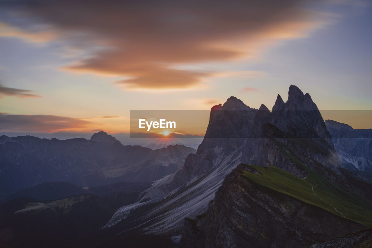 Scenic view of mountains against sky during sunset