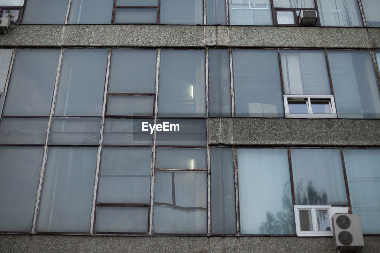 Facade of an air-conditioned office building. industrial building in the evening. 