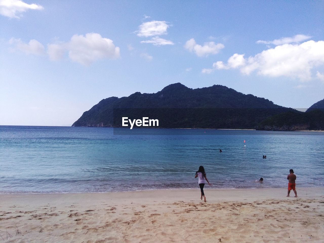 PEOPLE AT BEACH AGAINST SKY