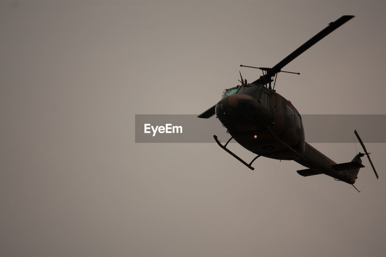 Low angle view of a flying helicopter