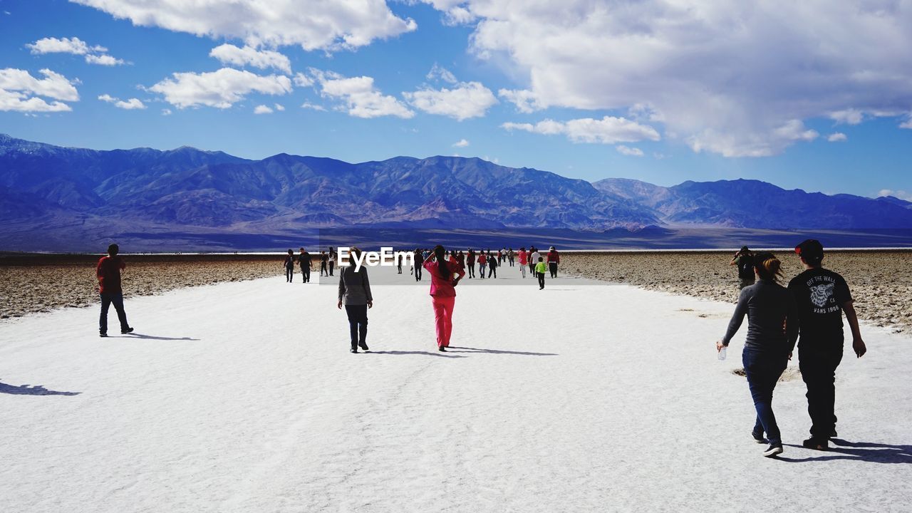 People at badwater basin on sunny day
