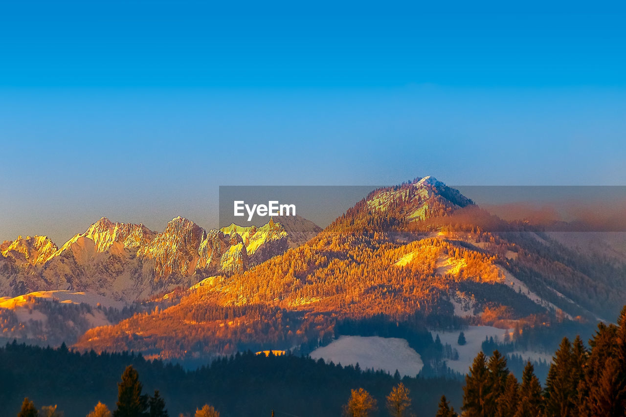 The kaiser mountains in tirol, austria, at sunset shows among others the wild emperor in the evening