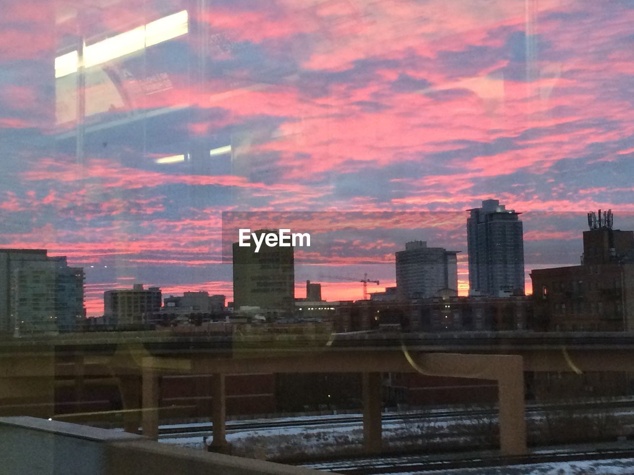 VIEW OF CITYSCAPE AT SUNSET